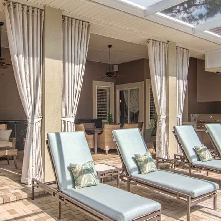 Stylish outdoor drapery designs showcased in The Fabric Source gallery for functional and elegant spaces.