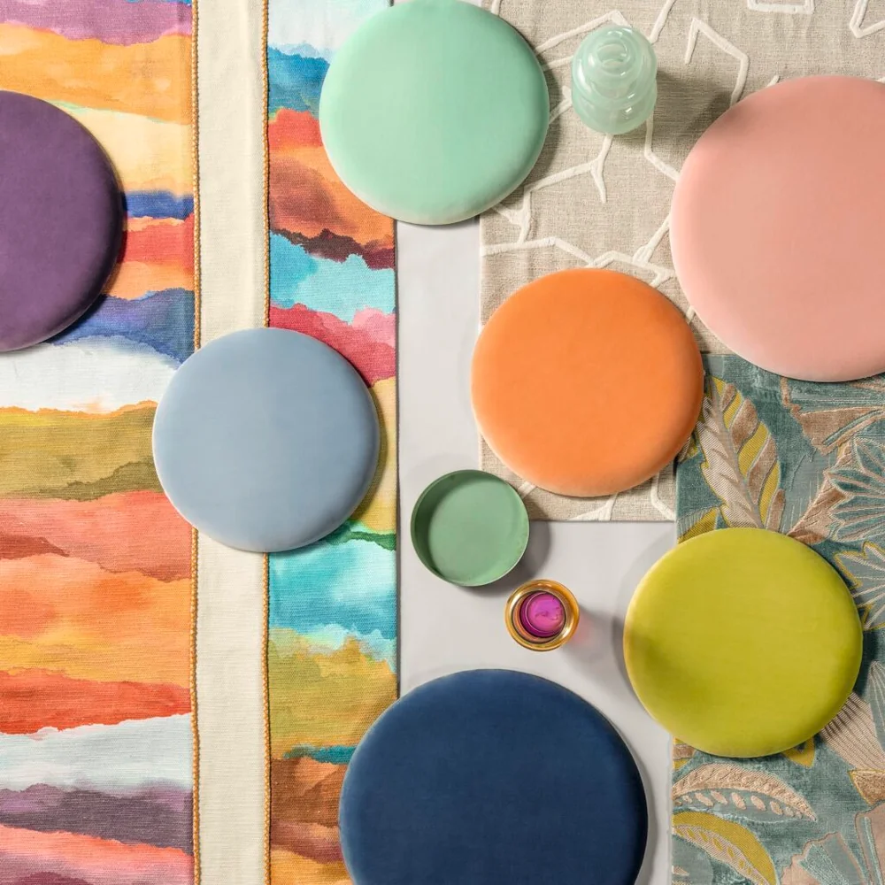 Colorful velvet upholstery pieces and patterned textiles from Carlucci