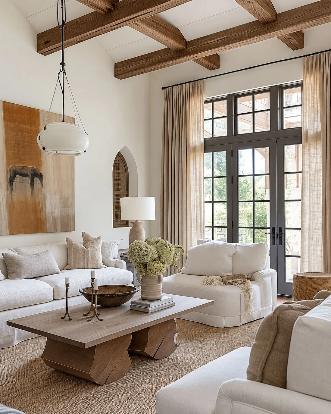 Layered drapery framing tall French doors in a warm, tailored living room