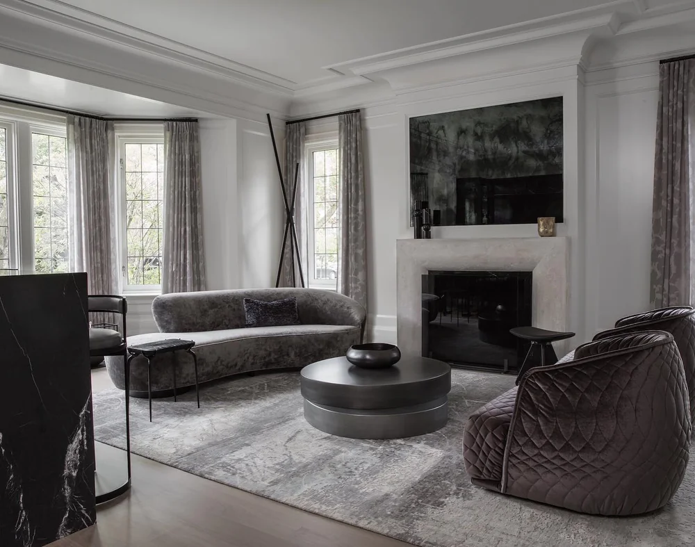 Neutral upholstered seating and tall drapery in an Interior Fabrics room setting