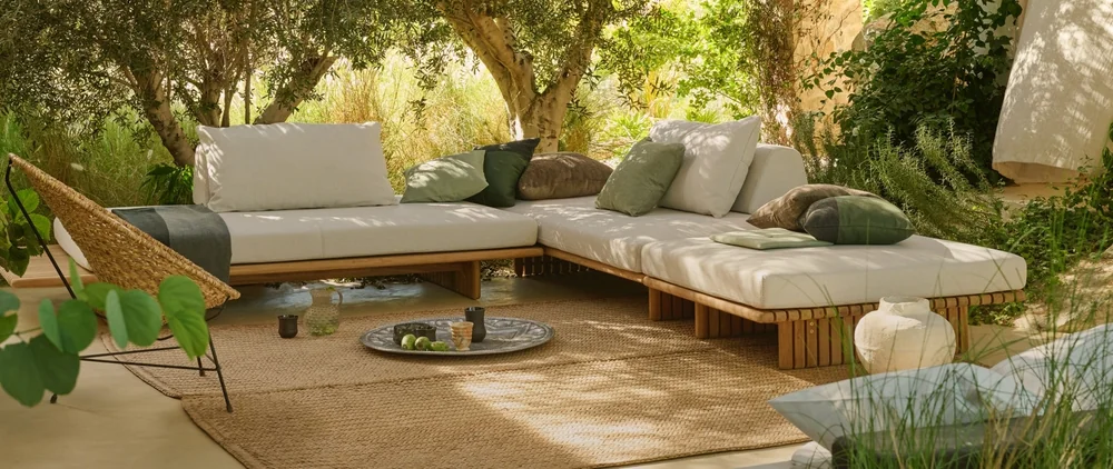 Sunbrella performance upholstery on outdoor lounge seating in a garden setting